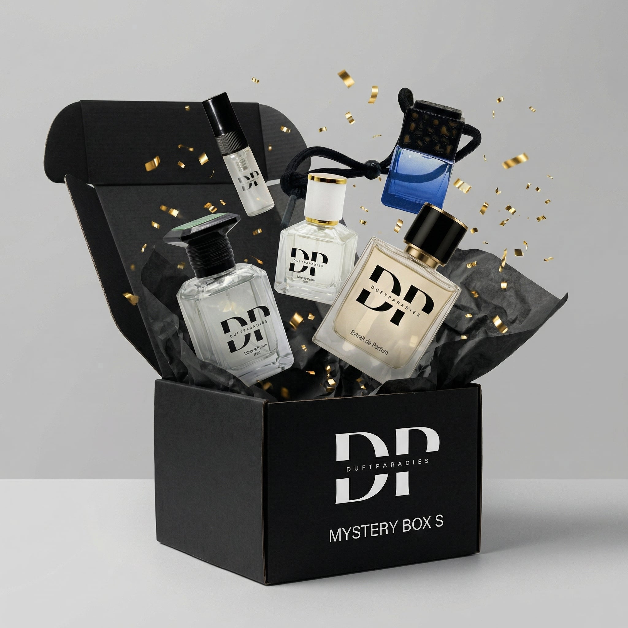 Verschiedene Duftparadies Mystery Box S mit Überraschungsdüften und Geschenken, stilvoll verpackt in einer eleganten Box